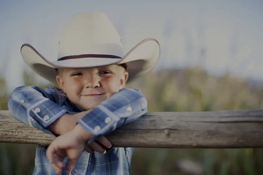 A Young American Cowboy Smiles